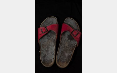 Pair of sandals displayed at the 'Cold Realities' exhibition.