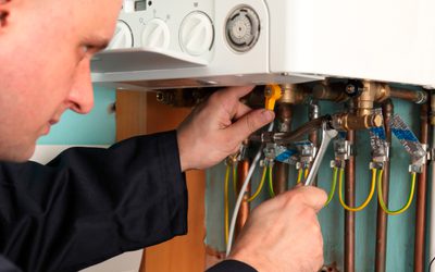 Technician working on a gas boiler.