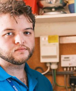 PEC Energy Advisor in front of a Radio Teleswitch Meter.