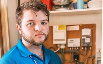 PEC Energy Advisor in front of a Radio Teleswitch Meter.