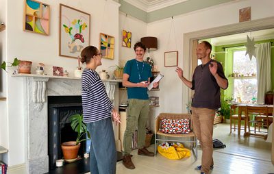 PEC Retrofit Advisors with a client during a home visit.