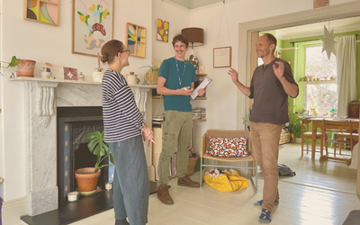 PEC retrofit advisors and a client during a home visit.