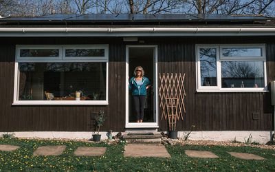 Zoe standing in front of her home.