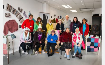 Group photo of PEC Pals volunteers and PEC staff at a workshop.