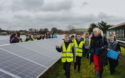 School children and their teachers during a visit to Ernesettle solar farm.