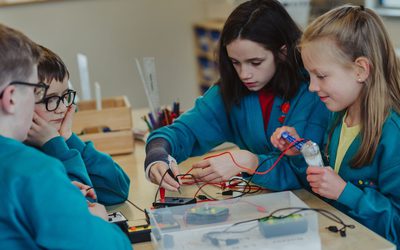 School children working with solar electricity kits during a group project.